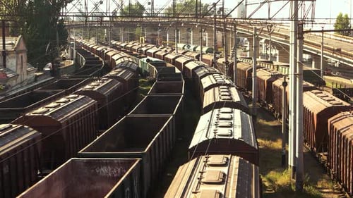 Aerial View of Extensive Railway Yard Full of Train Cars