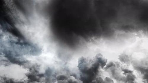 thunderstorm, flying towards the gray cumulonimbus clouds in the sky.