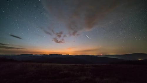 Night Sky Time Lapse over Rolling Hills