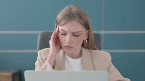 Close Up of Businesswoman Having Headache While Working on Laptop