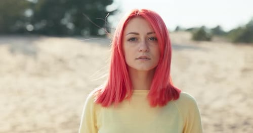 Young Woman With Red Hair In Nature Setting
