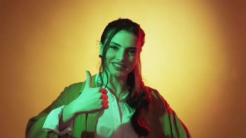 Young Woman Giving Two Thumbs Up