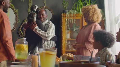 African American Family Greeting Guests at Home