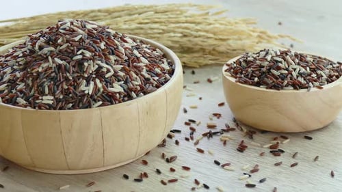 Wooden Bowls Filled with Rice Panning Shot