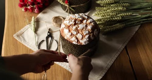 Decorating Easter Cake with String on Table