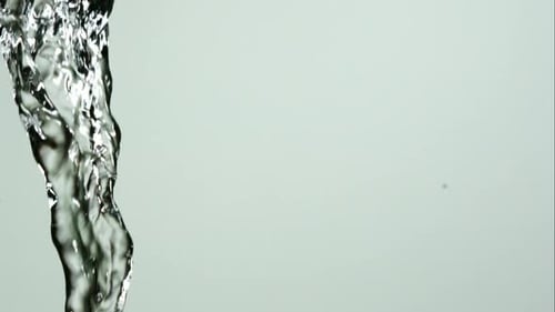 Water pouring and splashing in ultra slow motion 1500fps on a reflective surface - WATER POURS