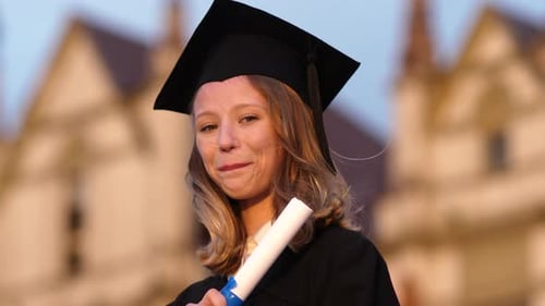 Graduation Girl Holding Her Diploma with Pride