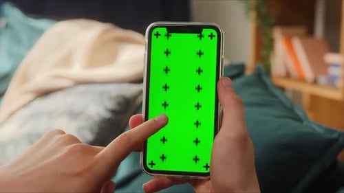 Closeup of Smartphone with Green Screen Young Man Hands Holding Mobile Phone Isolate Display Touch