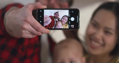 Happy Family Taking Selfie Together at Home