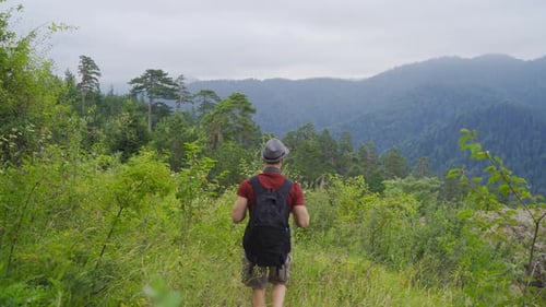 Tourist walking on the summit. Free and happy.