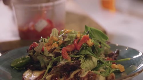 Restaurant Cooking Chef Serves Salad with Fish on a Plate