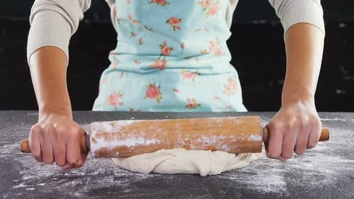 Woman using rolling pin 4k