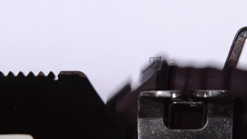 Typewriter Types "Thank You" on White Paper