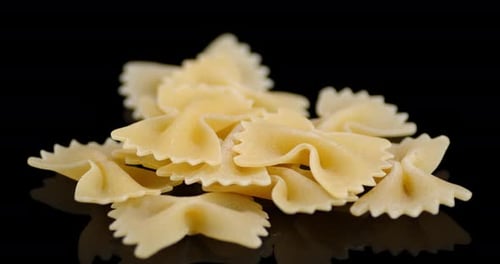 Farfalle Pasta Pile on a Black Background