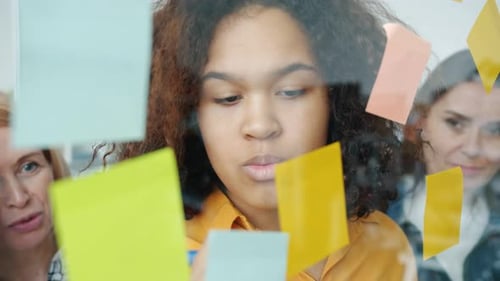 Team Brainstorming Ideas Together in a Modern Office