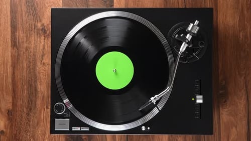 Eine Draufsicht von einem Vinyl-Player mit grünem Titelkreis