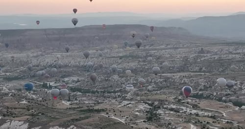 Aerial Cinematic Drone View of Colorful Hot Air Balloon Flying Over Cappadocia