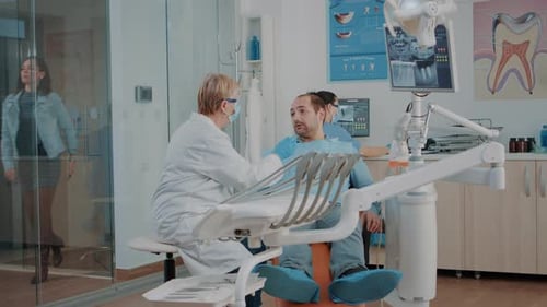 Dentist Consulting Patient in a Dental Clinic