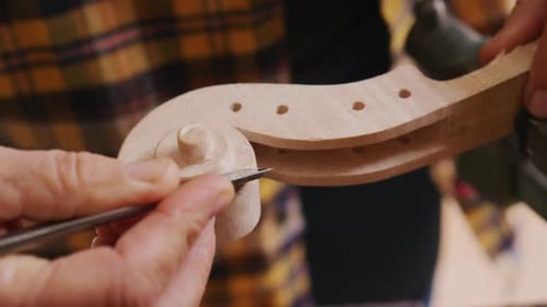 Female luthier at work in her workshop