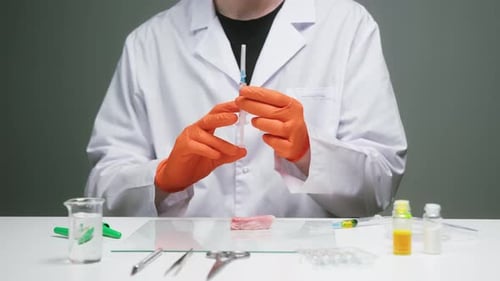 Scientist Injecting Meat with Syringe in Lab