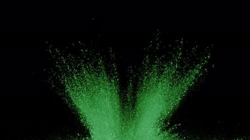 Green powder exploding on black background in super slow motion, shot with Phantom Flex 4K