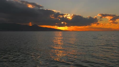 Sea Sunlight And Rainy Clouds