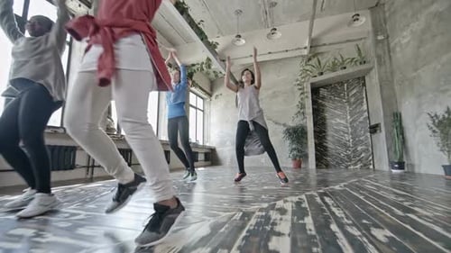 Women Dancing Together in a Fitness Class