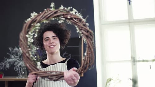 Woman Creates Floral Wreath in Bright Studio
