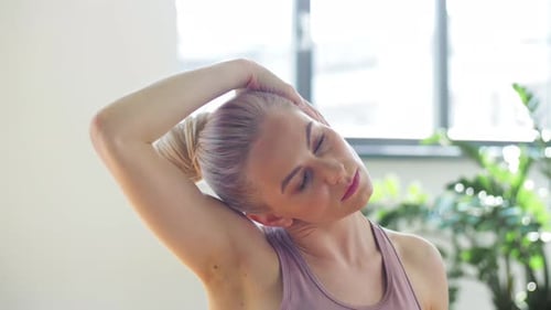 Woman Doing Yoga Exercise at Studio