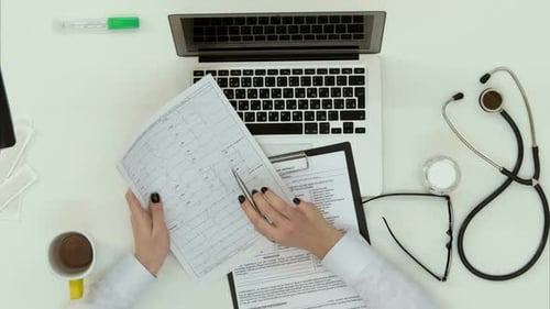 Female Medicine Doctor Hands Filling Patient Medical Form