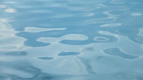 Tranquil Water Ripples in Subtle Blue Light