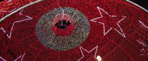 Low angle view of a giant red ball installation for Christmas holiday season.