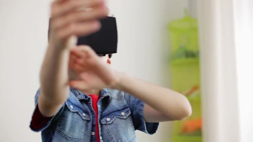 Boy Wearing VR Headset Interacting with Virtual World