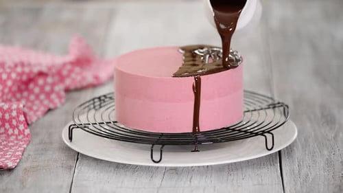 Pink Cake Decorated With Chocolate Sauce