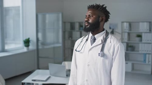 Doctor with Stethoscope Standing in Doctor's Office