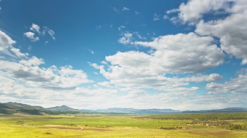 Scenic Valley with Beautiful Clouds Passing Overhead