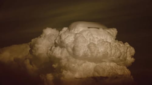 Puffy Clouds Billow at Twilight