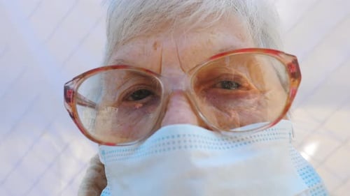 Close Up Face of Granny in Protective Mask From Virus