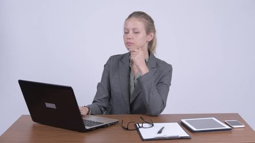Professional Woman Shocked by Information on Laptop