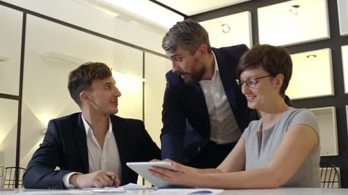 Business People Discussing Plans in Modern Office