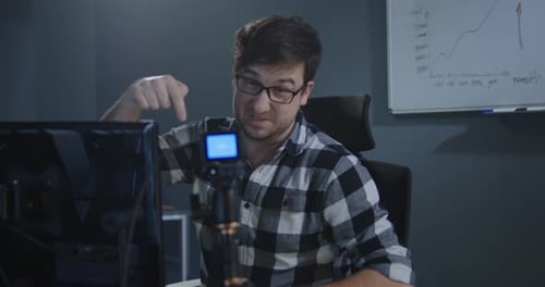 Man Recording a Vlog in Office