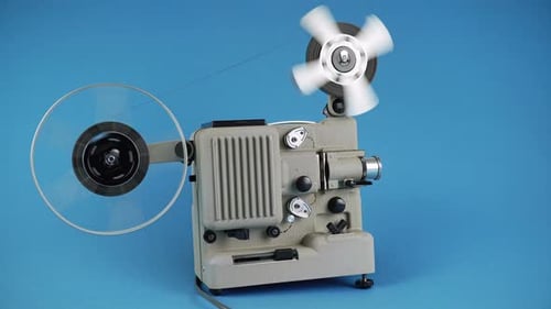 Old Film Projector Running with Reels Spinning