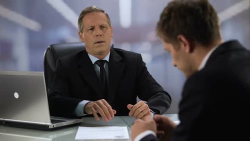 Businessmen Handshake in Office Setting