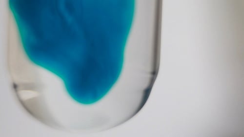 Blue Liquid Mixing in a Beaker