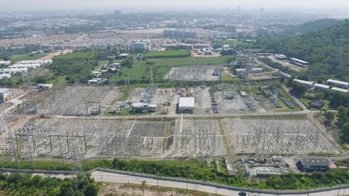 Aerial view of electricity generating, voltage poles. Power lines on utility tower and cable wires