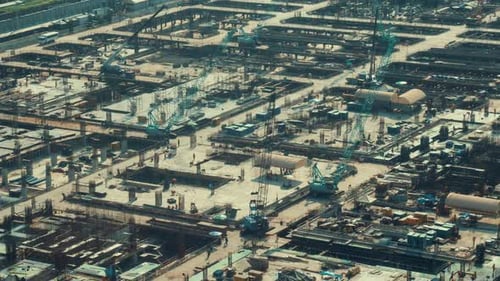 Time lapse of construction site with heavy construction machinery in metropolis