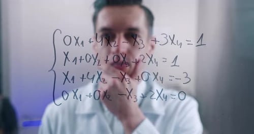 Man Thinking About Complex Equations Written on Glass