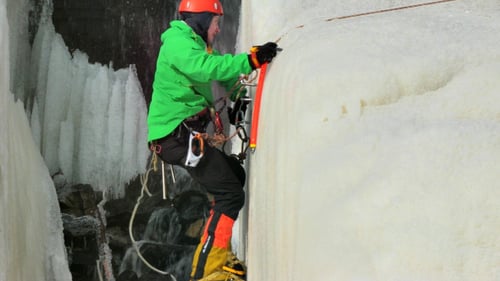 Climber On Ice Wall