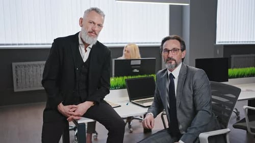 Confident Businessmen Posing in a Modern Office