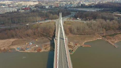 Aerial Drone Flight Footage of a Bridge with Car Traffic Surrounded By Beautiful City Landscape